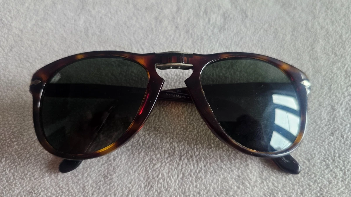 Persol brown frame folding sunglasses. 714.