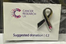 Cancer research Charity pin badge. Silver bow with pink crystal. Mint