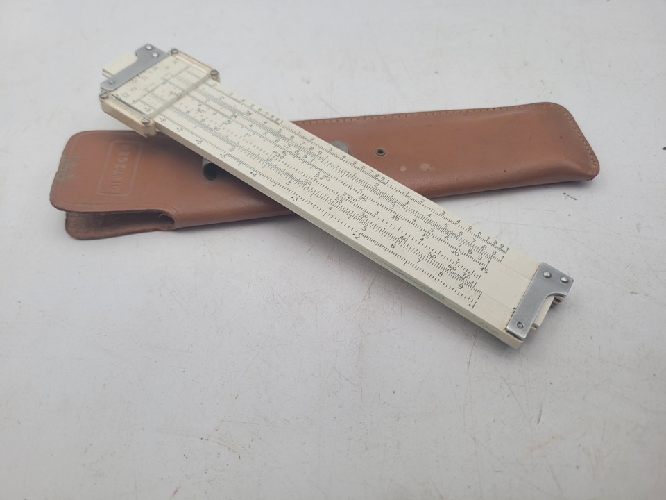 The Dietzgen Redirule No. 1776 is a pocket slide rule with a patriotic serial number and a slick belt-clip case — a conversation piece that fits in your pocket.