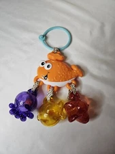 Infantino Orange whale fish and dangling rattles baby toy jingle activity