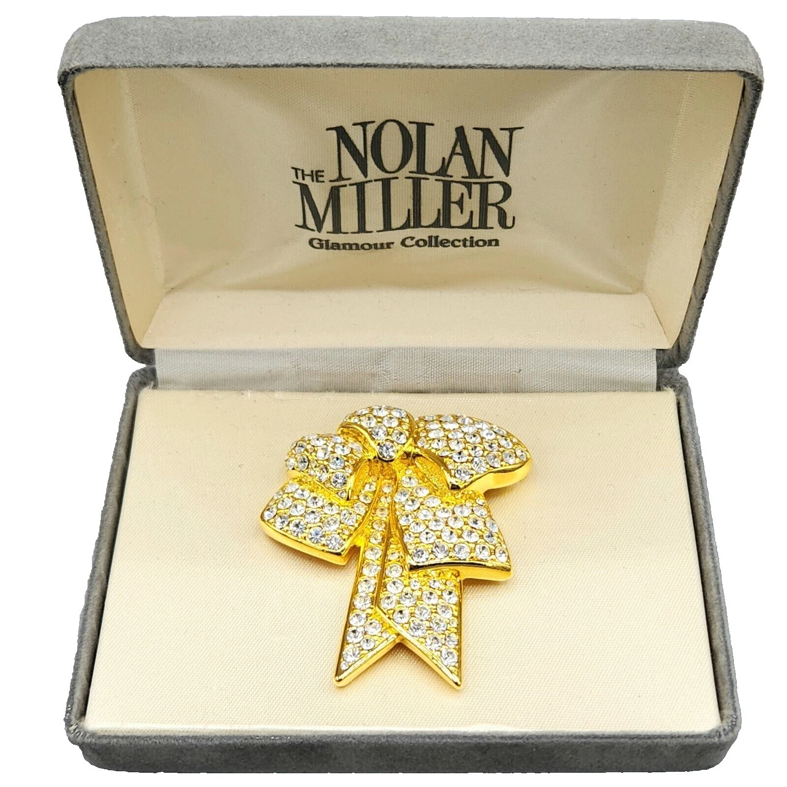 Nolan Miller Broches DE MODA