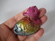 A Bismuth Baby Dragon in egg, 100 grams, 6 cm long, 5.2 cm tall x 1.6 cm deep
