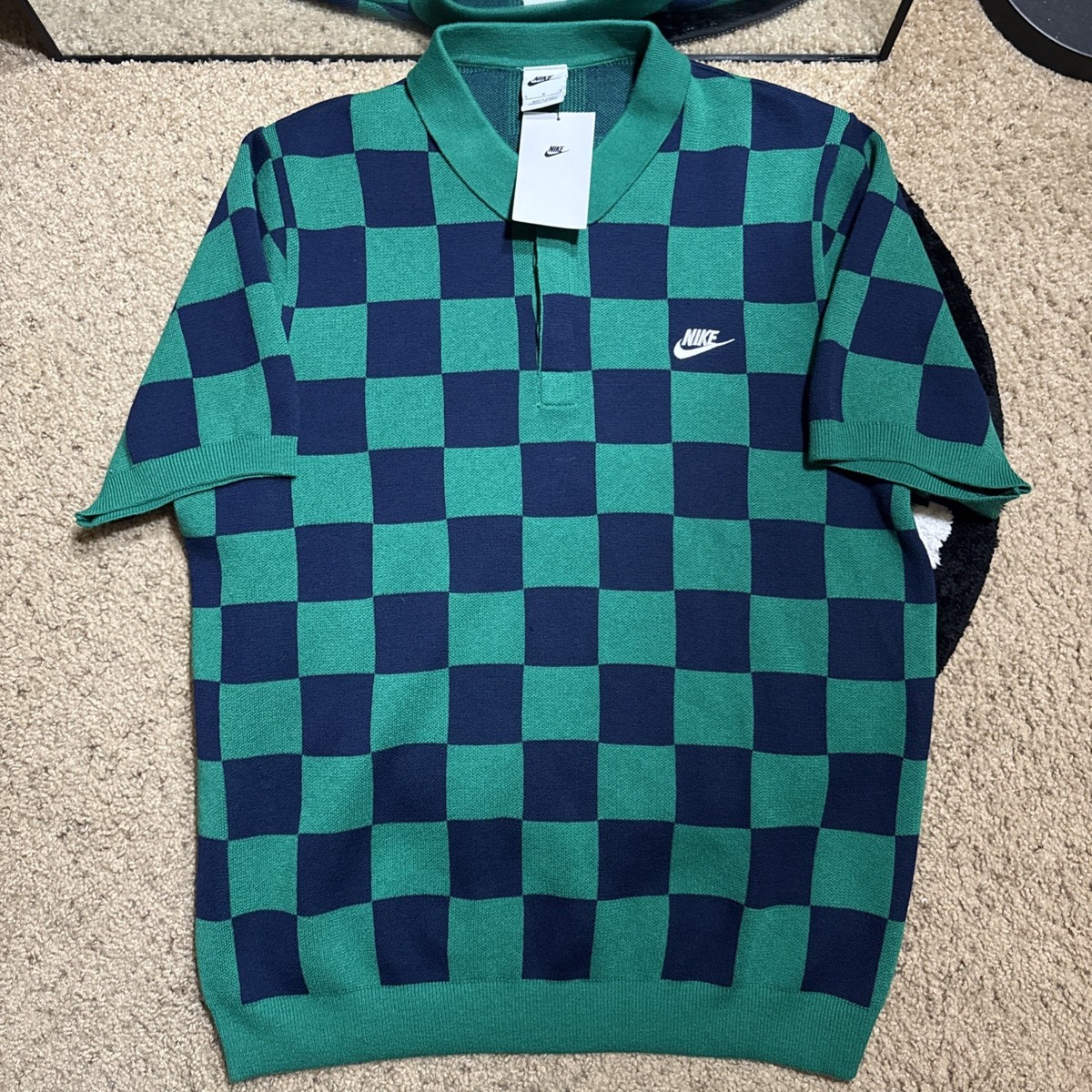 blue and green nike shirt
