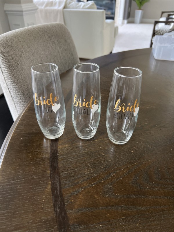 Set of 3 BRIDE SQUAD Champagne flutes. Gold and black letters with white heart