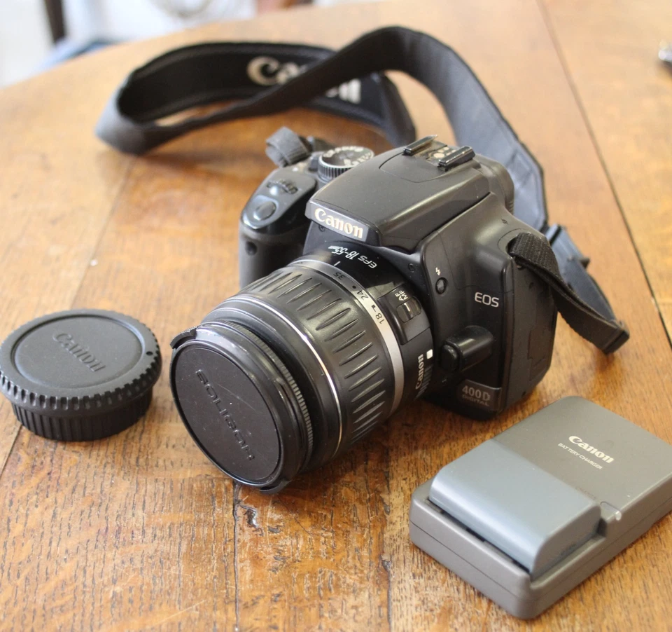 Canon EOS 400D - Objektiv = Canon 18~55 Zoom - Ladegerät ohne Kabel - 2 Akkus - Bild 1 von 4