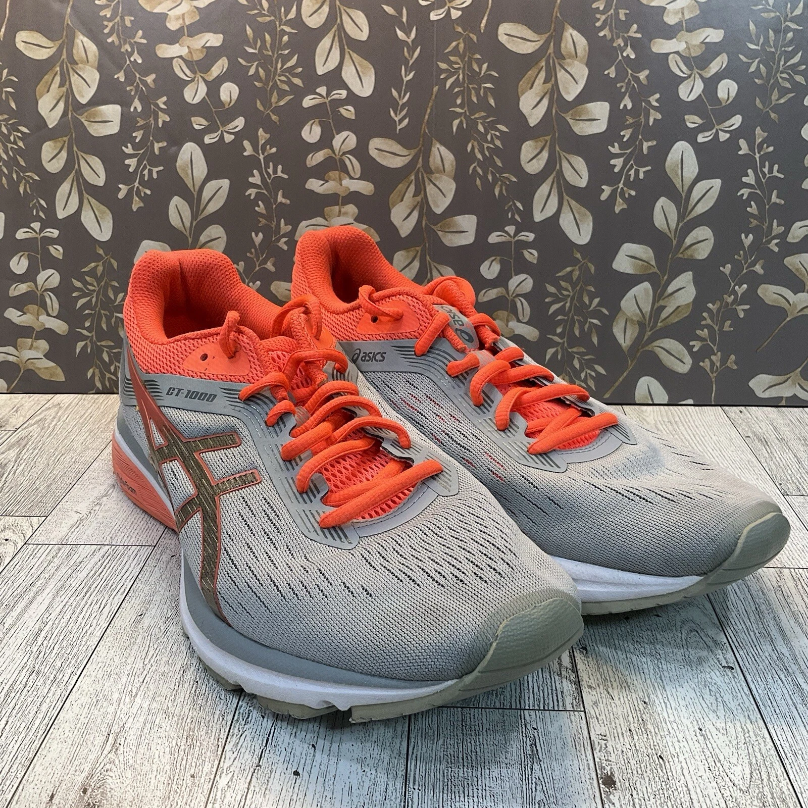 Scarpe da corsa Asics GT 1000 7 grigio arancione donna taglia 9 5 1012A030