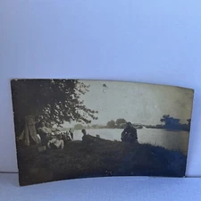 RPPC Riverboat Guys Relaxing On Riverbank Under Trees Pipe Smoking 24