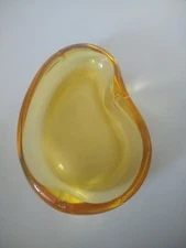 Vintage Oval MCM Ashtray  Amber 7.75" x 5.5 scratches on inside bottom heavy.