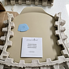 New Pampered Chef pizza stone 100251 in gray foam packaging with instructions and visible branding.