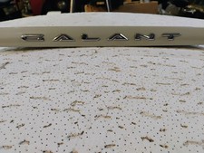 1999-03 Mitsubishi Galant Trunk Handle Trim Name Plate Mr971372