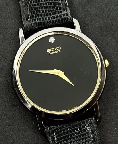 Vintage New 1998 SEIKO Men’s 35mm Quartz Watch Black Case Gold Trim Gen. Lizard