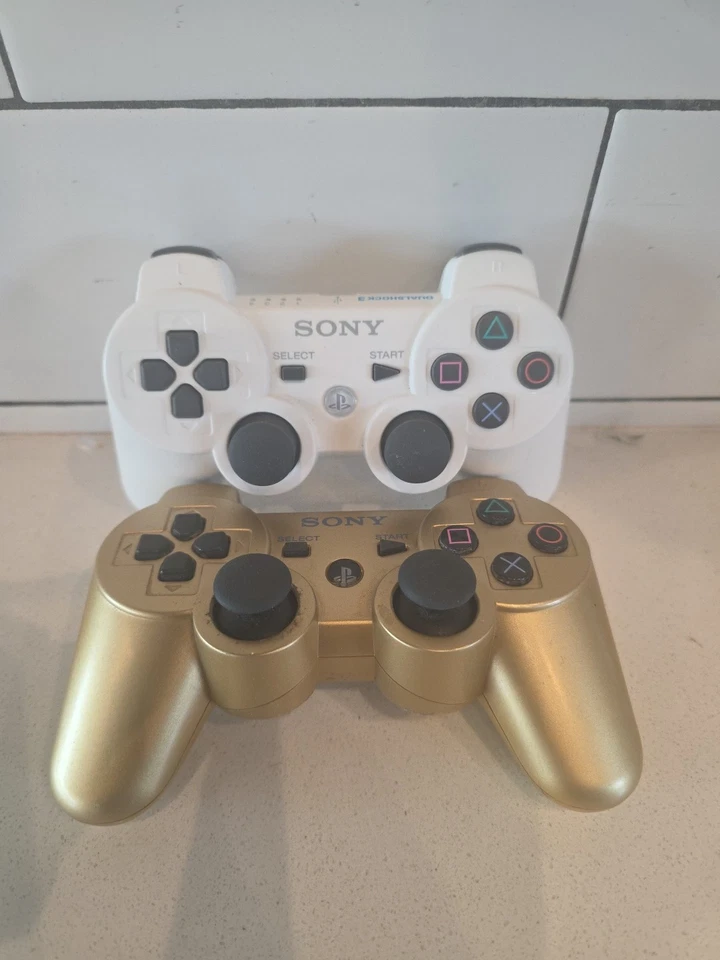 2 controladores originales OEM Sony Playstation 3 CECHZC2U PS3 DualShock 3 - dorado/blanco Foto 2 de 4