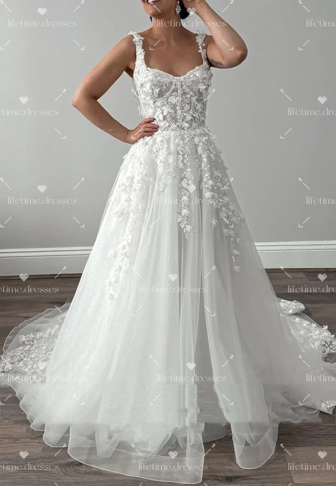 Vestidos de novia elegantes blancos marfil con cordones sin mangas con cuello cuadrado Foto 2 de 4