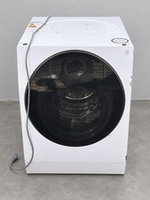 White LG SIGNATURE washer dryer with 12kg washing and 7kg drying capacity.