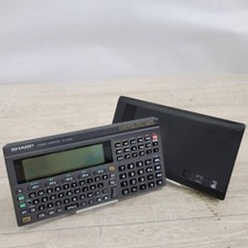 Sharp PC-E500 pocket computer 32KB memory large display BASIC language