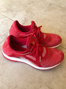 red and pink adidas trainers