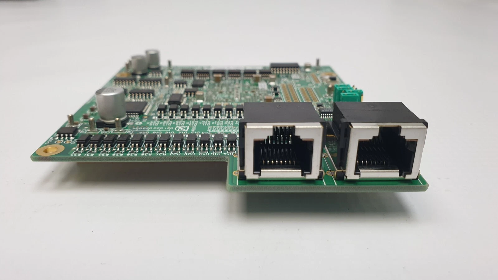 Edge view of the two RJ-45-style modular jacks on the Tokyo Electron 3Z81-000001-V3 board