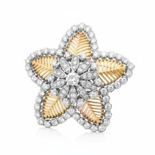 A brooch in gold, platinum and diamond By Cuzi