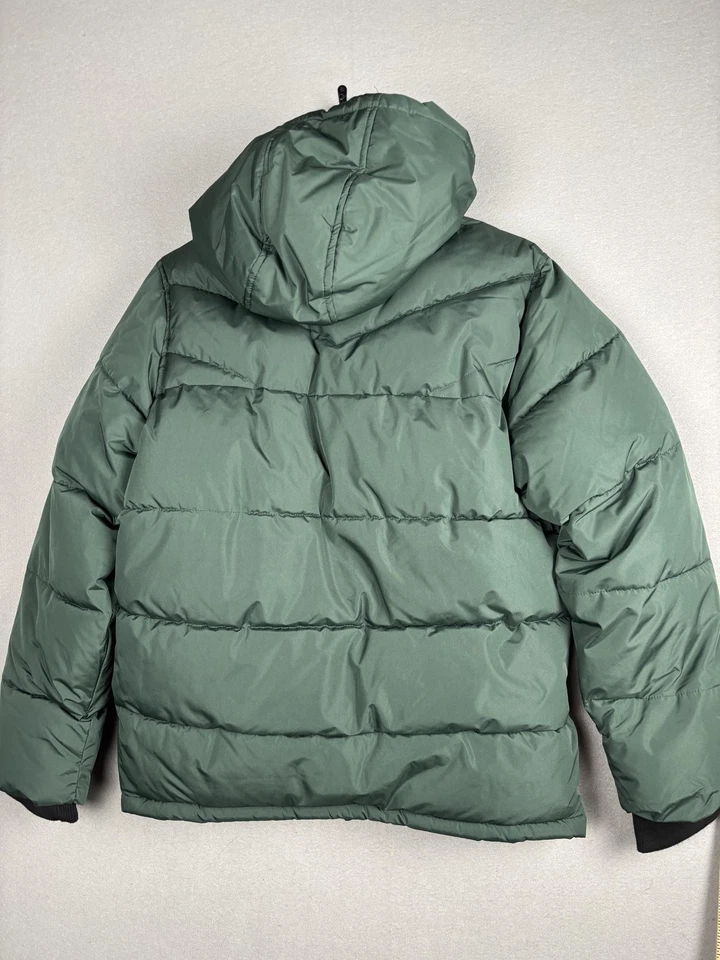 Chaqueta acolchada Reebok para hombre pequeña verde con capucha forrada de lana abrigo de invierno aislado Foto 3 de 4