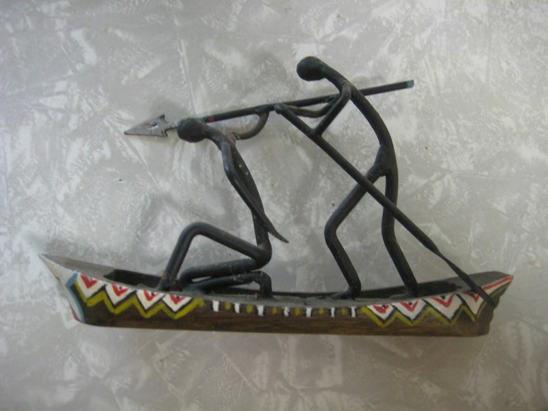 HANDCRAFTED METAL FIGURINE OF TRIBEMAN FROM KENYA.DESIGNED BY PETER MEDWAY