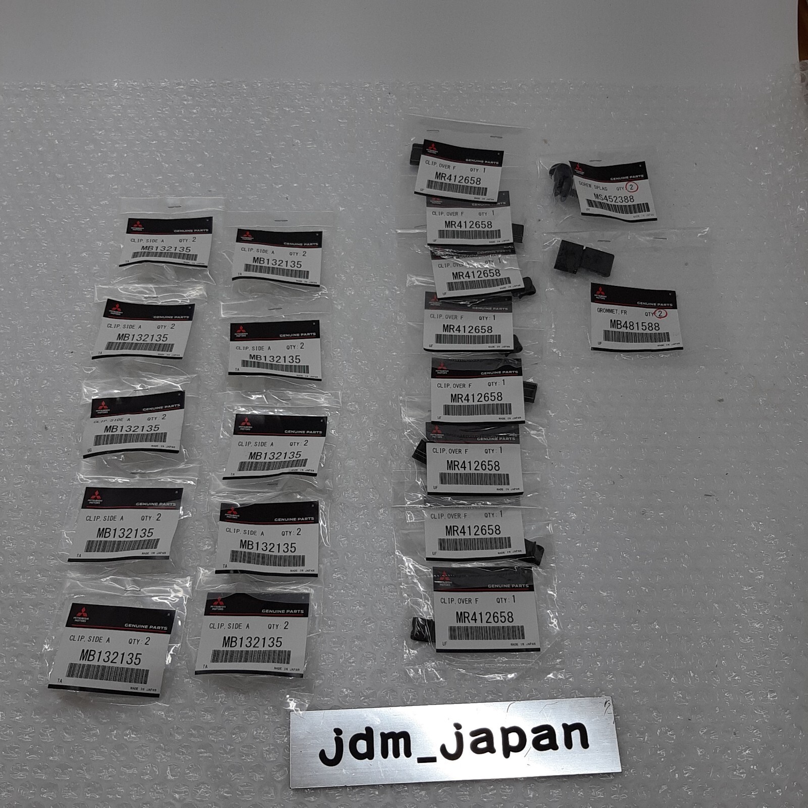 Mitsubishi Lancer Evolution V/VI CP9A Genuine OEM Over Fender Clip Set