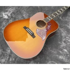Stock Acoustic guitar cherry burst hummingbird solid spruce board top mahogany
