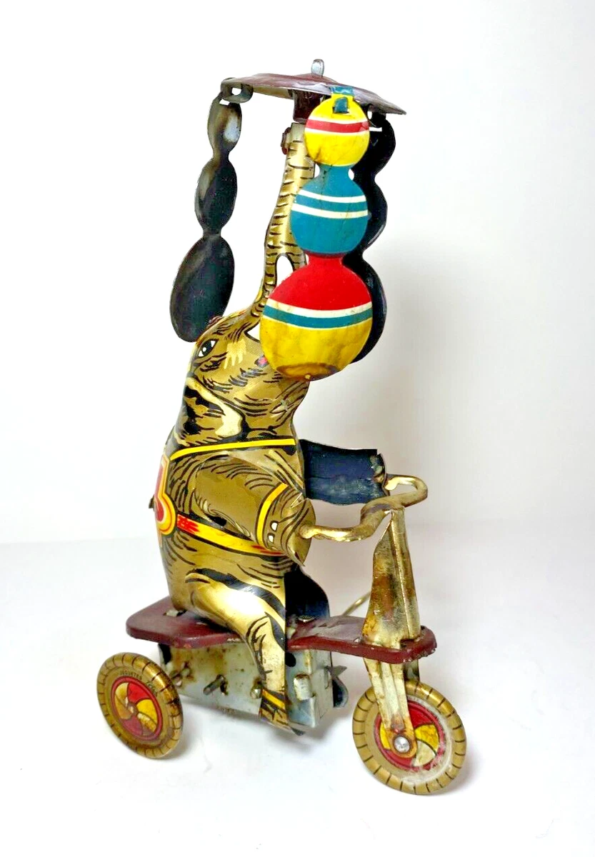 VINTAGE TIN LITHO CIRCUS ELEPHANT ON TRICYCLE WINDUP TOY