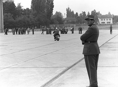 Swiss policeman looking far during Geneva Summit to discuss global- Old Photo
