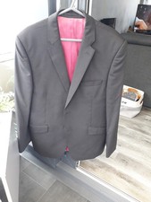 Performance mens black suit. Worn once . Jacket size 42 pants 36s.Wool blend