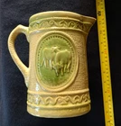 A E Hull Salt-Glazed Stoneware “Grazing Cows” Pitcher - Yellow Ware w/ Green