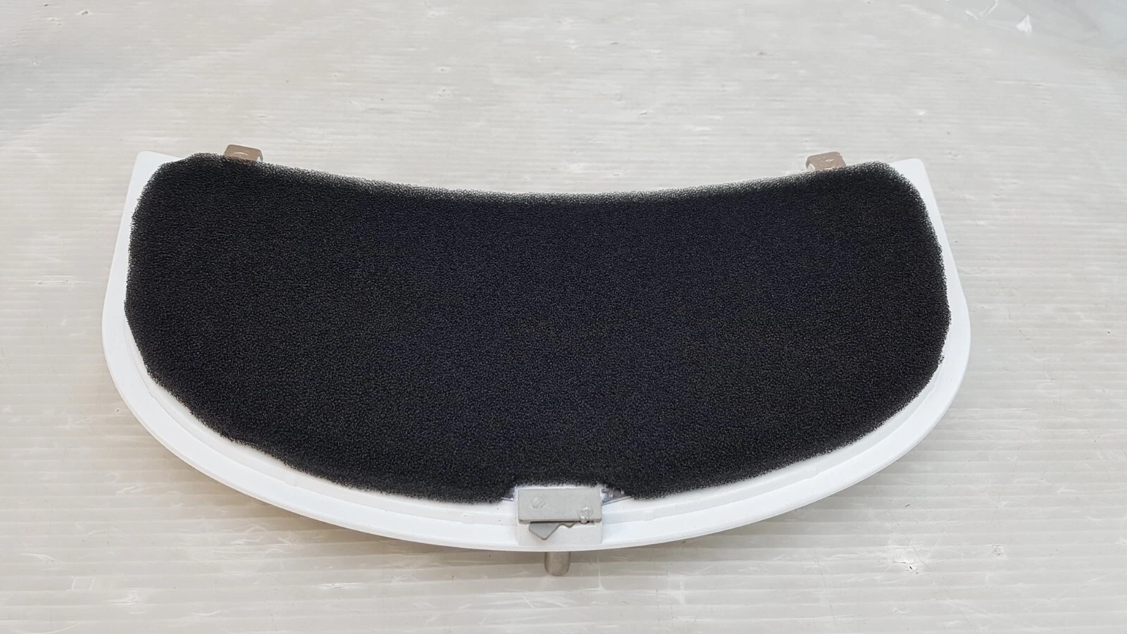 Black foam filter pad on the back of the Lumenis panel, side view
