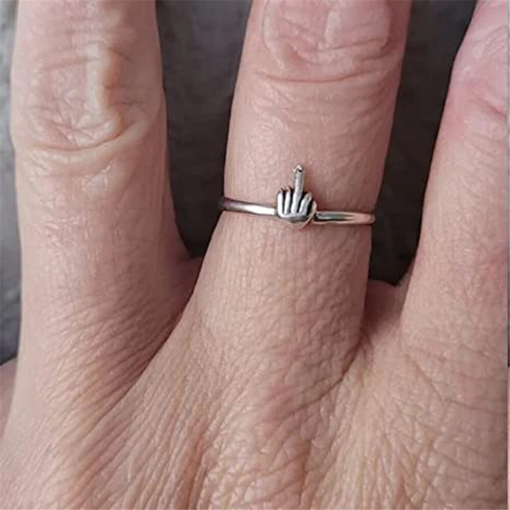 Woman Hand Silver Rings Showing Middle Finger Pink Background Stock Photo  by ©cellar-door 227217242