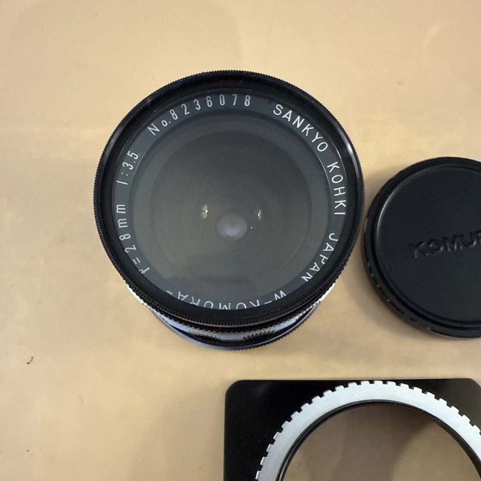 Lente Sankyo Kohki W-Komura 28 mm 1:3,5 Uni montaje de tornillo automático Foto 2 de 4