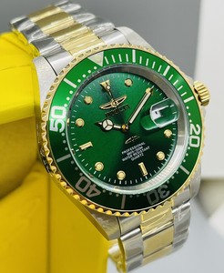 invicta green face