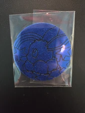 Pokemon Prismatic Evolutions Tin JUMBO Glitter Eevee Coin Blue