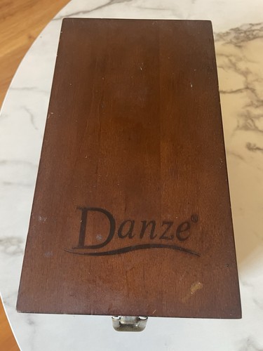 Wooden box for displaying coins with the name marked Danze