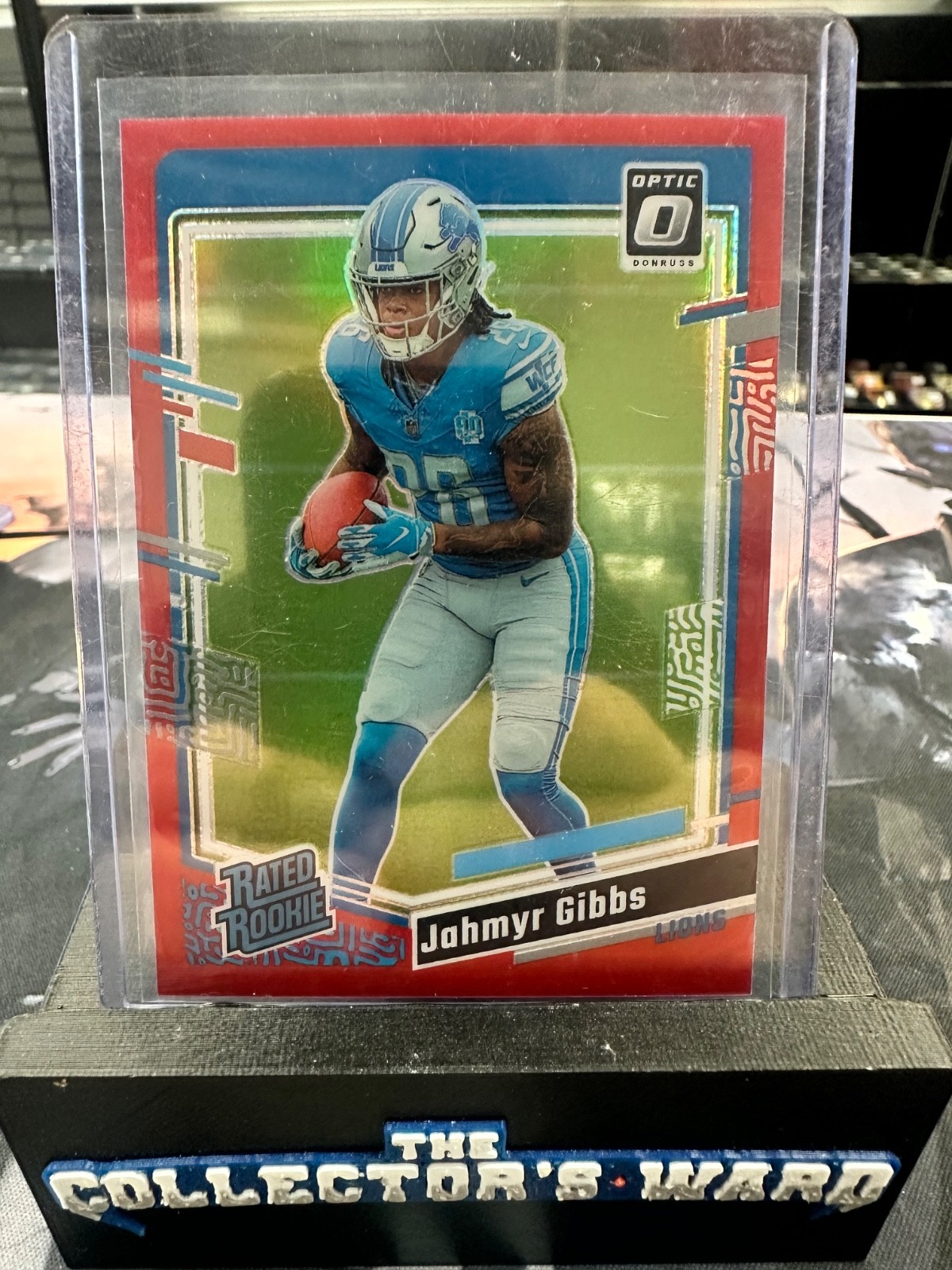 2023 Panini Donruss Optic - Rated Rookie Jahmyr Gibbs #236 Red Prizm /99 (RC)