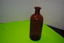 Amber glass Apothecary bottle 7 3/4 inches tall and 3 inches in diameter w/o cor
