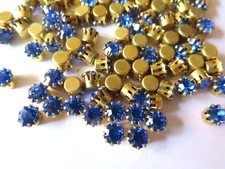 72 Swarovski Rhinestones 24ss Sapphire/Tiff. Brass setting.