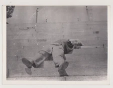 Young Man Melts Into the Steps Under the Warm Embrace of Light Snapshot Abstract