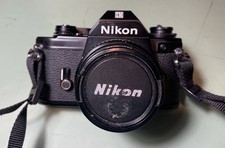 Nikon EM SLR 35mm Film Camera W Lens and filter adn strap