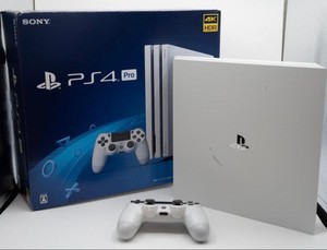 PS4 500 Go modèle CUH-1116A en blanc + accessoires + 4 jeux - Jeux vidéo