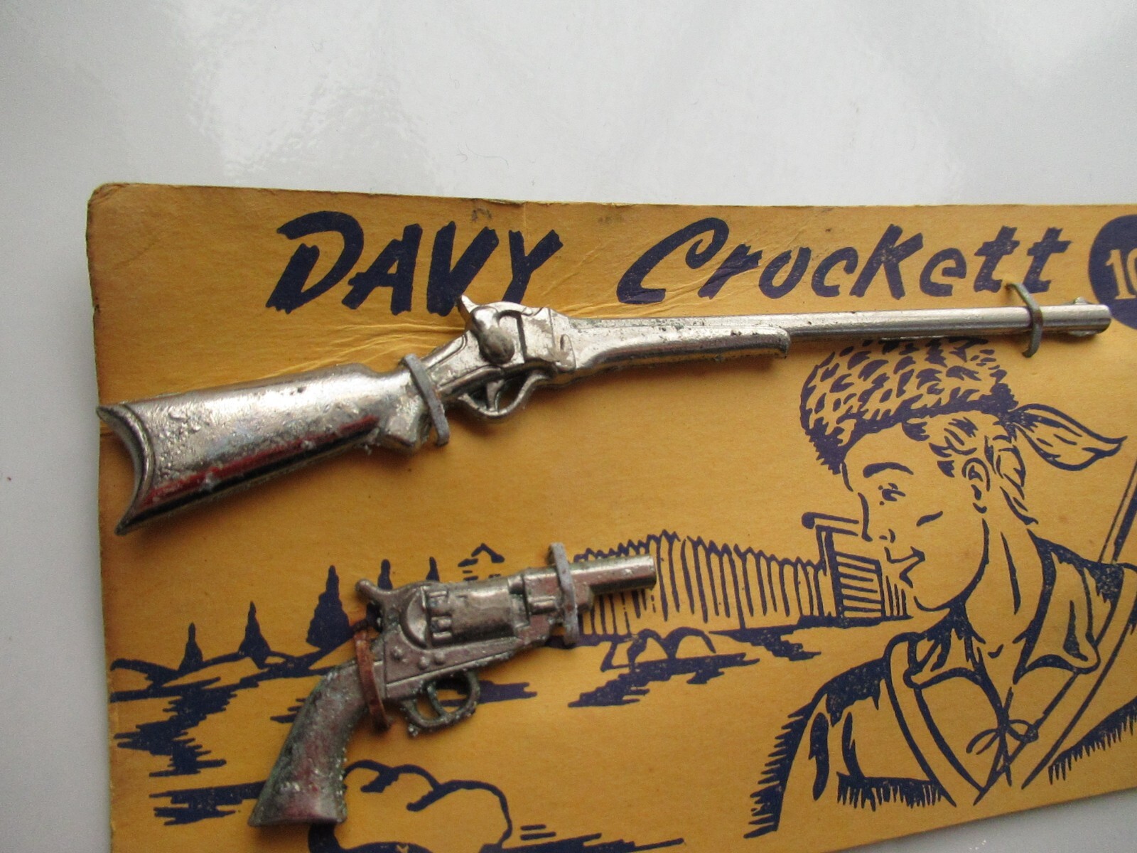 VINTAGE DAVY CROCKETT SMALL TOY METAL GUN RIFLE ON ORIGINAL CARD MARKED