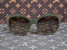 Chloe CE627S cat-eye sunglasses in khaki featuring gold studded details along.