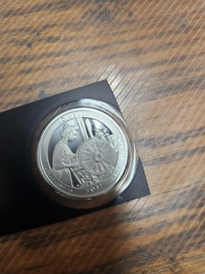 2019 Silver Proof Quarter.  Lowell , slightly yellowish on the rim . toned coin