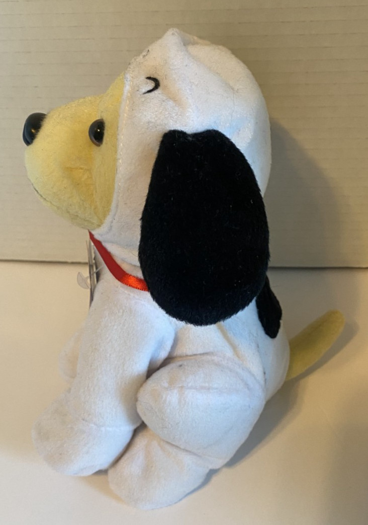 Raising Cane's Yellow Labrador dressed as snoopy Charlie brown Peanuts plush
