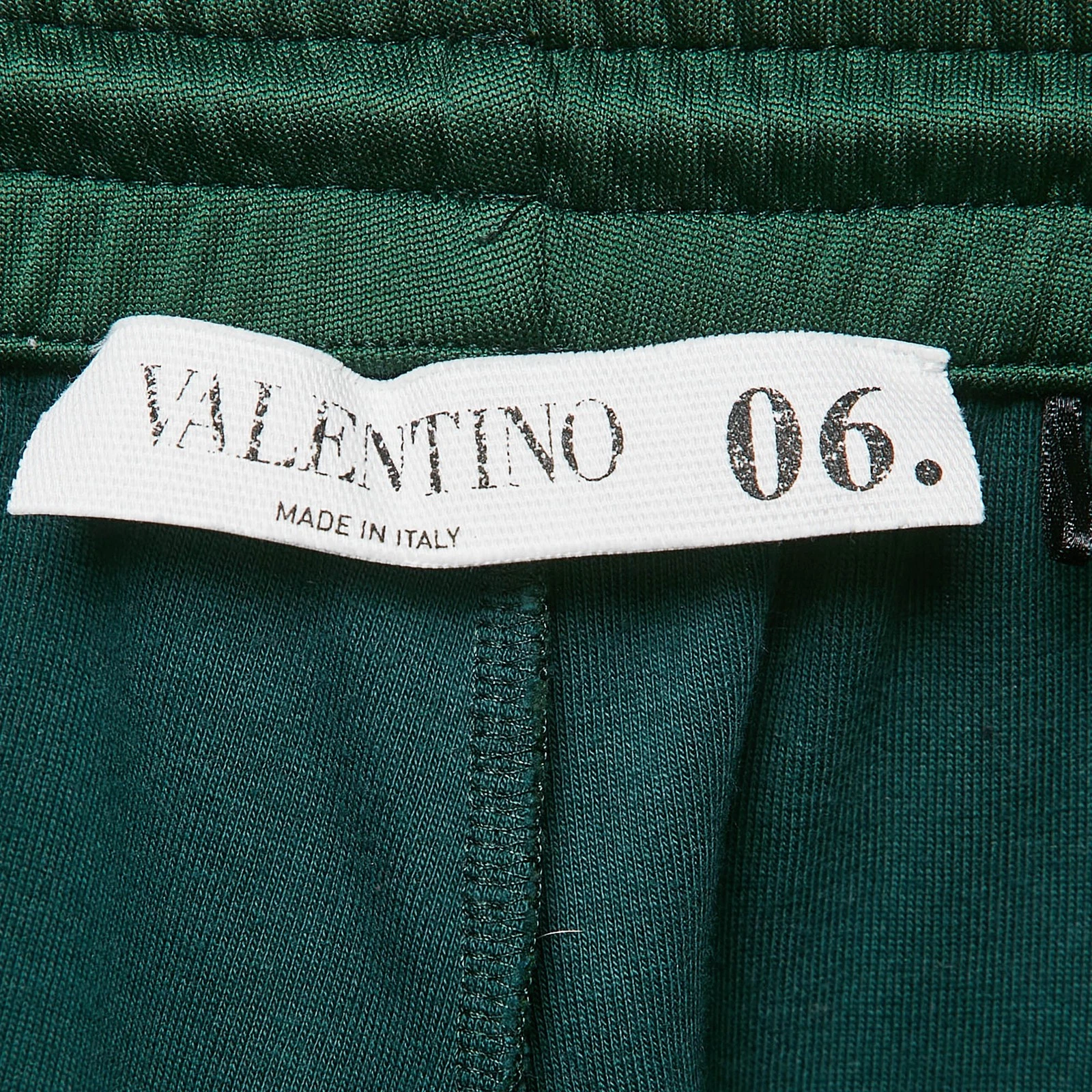 Pantalone jogger Valentino verde in jersey con borchie M