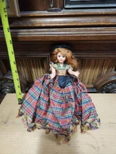 Antique Doll. Beautiful Redhead with moveable arms and sleep eyes.