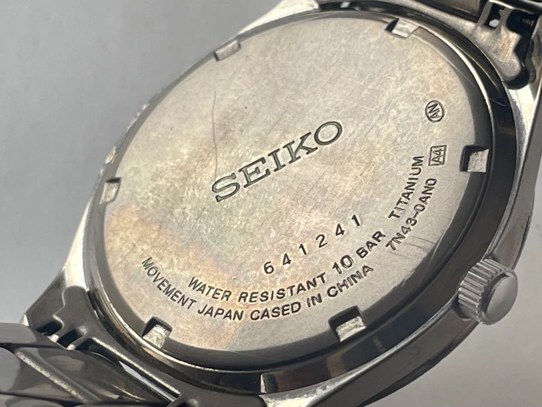 SEIKO Titanium 7N43-0AN0 Mens Quartz Watch Day Date 10BAR Silver