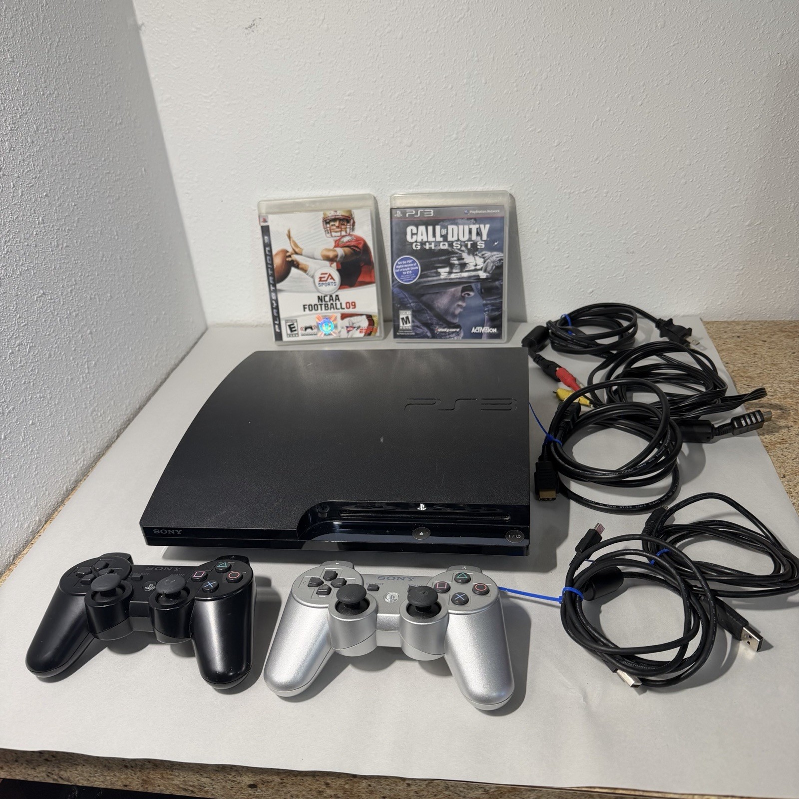 Sony PS3 Slim CECH-2001B 250GB Console + 2 Controllers + Cables + 2 Games